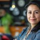 232511036-latin-businesswoman-portrait-at-her-office
